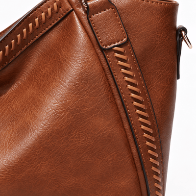 The Sunday Avenue Brown Whipstitch Fringe Tote Bag with Tassel Charm