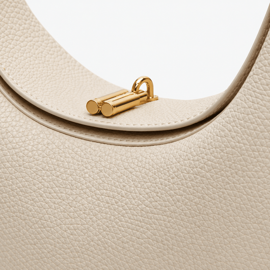 The Sunday Avenue Celeste Cream Pebbled Leather Crescent Shoulder Bag