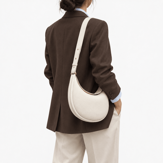 The Sunday Avenue Celeste Cream Pebbled Leather Crescent Shoulder Bag